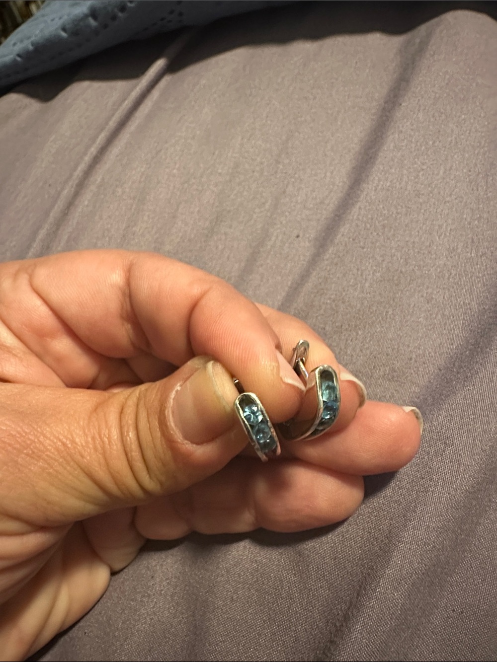 White gold earrings with blue topaz
